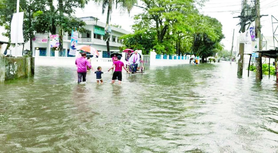 Sunamganj Sadar Upazila being devoured by the onrush of hilly waters, causing untold sufferings to thousands of people. This photo was taken from Shilukala crossing on Friday.