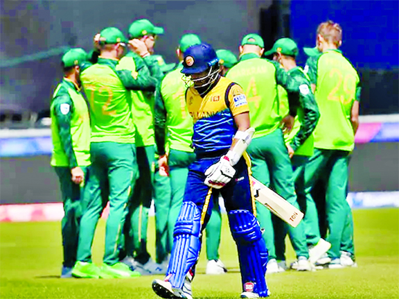 Players of South Africa celebrate after dismissal of Kusal Perera during the match of the ICC World Cup Cricket between South Africa and Sri Lanka at Chester-le-Street in England on Friday.