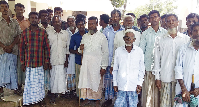 Locals at Halhalchhari brought out a rally protesting clash over land of graveyard recently.