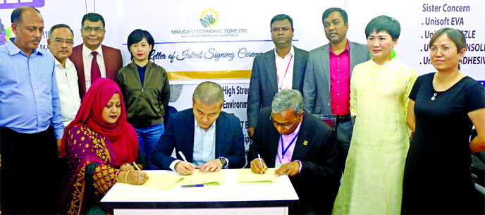 Sk Monowar Hossain, Director of Sirajganj Economic Zone Ltd, Mahmuda Akter Shammy Chairman Unisoft Group and Weichi Chung, Director ASFROM China, signing a Letter of Intent (LOI) for lease and purchase of land in the Economic Zone at Bashundhara Conventio