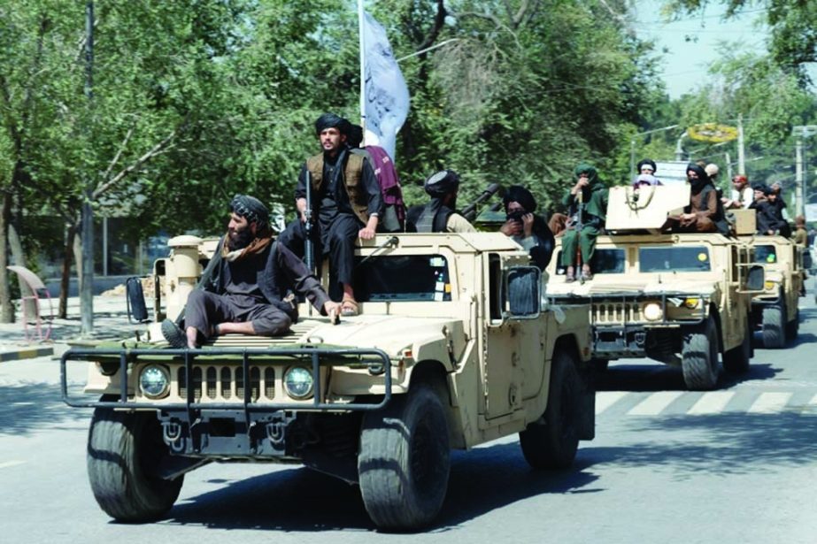 Taliban fighters parade on Humvee vehicles as they celebrate the first anniversary of the withdrawal of US-led troops from Afghanistan, near the former US embassy in Kabul on Wednesday. Agency photo