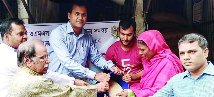 SHAHZADPUR (Sirajganj) : Md. Tariqul Islam, UNO inaugurates OMS rice sale programme at Shahzadpur Upazila on Thursday.