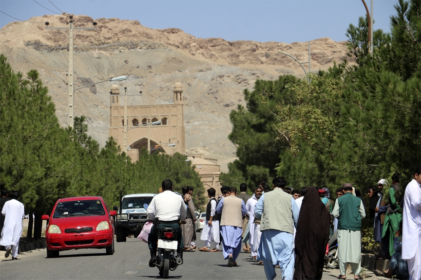 Afghan people gather near the site of an explosion in Herat province, Afghanistan, Friday, Sept 2, 2022.