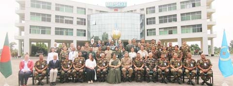 Commandant of Armed Forces Institute of Pathology Major General Susane Geeti poses for a photo session with officers and trainers who participate in Female Military Officers' Course at Rajendrapur Cantonment in Gazipur on Thursday.