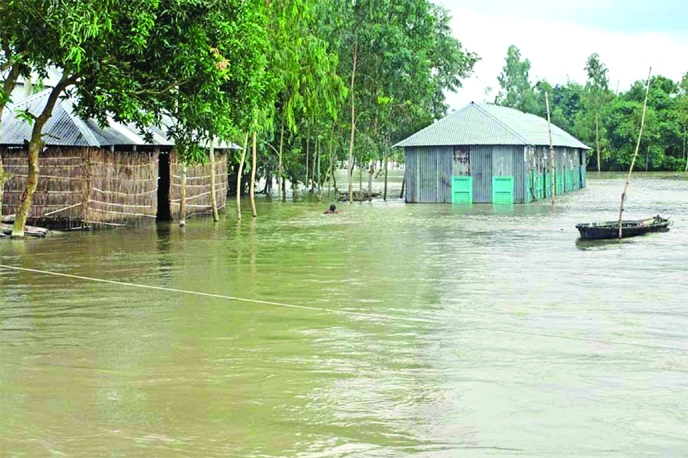 A low-lying area of Rangpur district gets inundated as the rising water level of Teesta was flowing on Friday. As a result, panic grips among the local people.