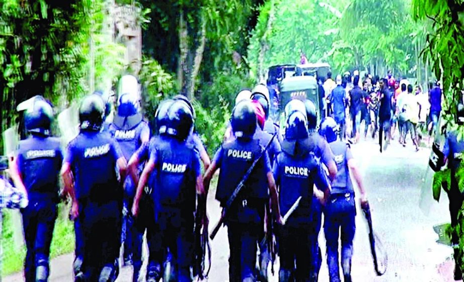 Police on action during their clash with BNP activists at Pakundia in Kishoreganj on Saturday. NN photo