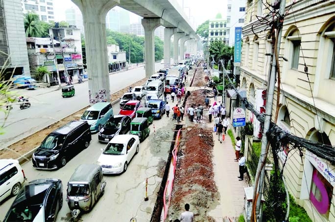 Vehicles struggle to pass at Bangla Motor area on Sunday, as different types of development works are going on the busy roads of the capital. As a result, vehicular cum pedestrians movement hampared.