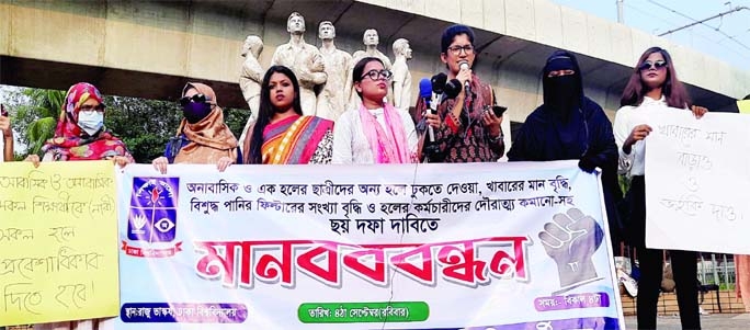 Female students of Dhaka University form a human chain in front of Raju sculpture on Sunday to press home their six-point demands.