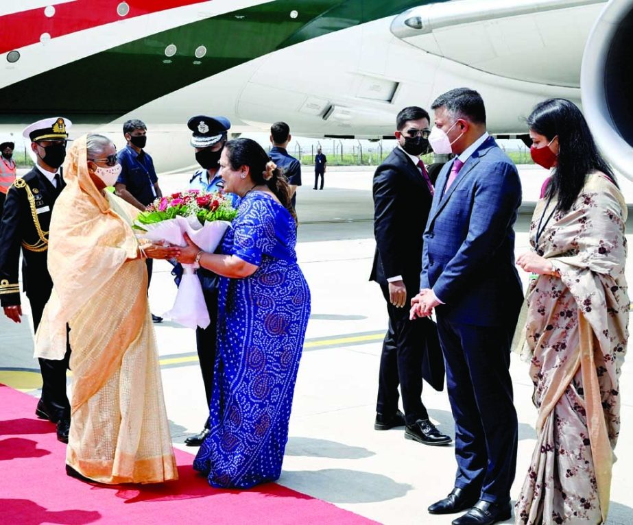 Prime Minister Sheikh Hasina is warmly welcomed by India's State Minister for Railways and Textiles Darshana Vikram Jardosh on her arrival at the Palam Airport in New Delhi on Monday morning. PID photo
