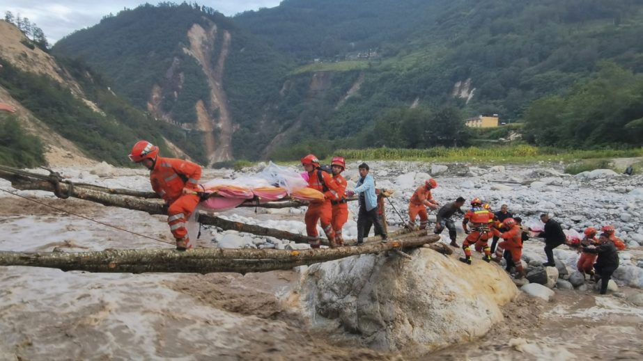 In this photo released by Xinhua News Agency, rescuers transfer survivors across a river following an earthquake in Moxi Town of Luding County, southwest China's Sichuan Province Monday, Sept. 5, 2022.