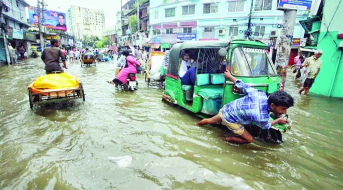 SYLHET: Water-logging has been created in different roads of Sylhet City due to continous heavy rainfall for threedays till Tuesday .The snap was taken from Mendibagh.