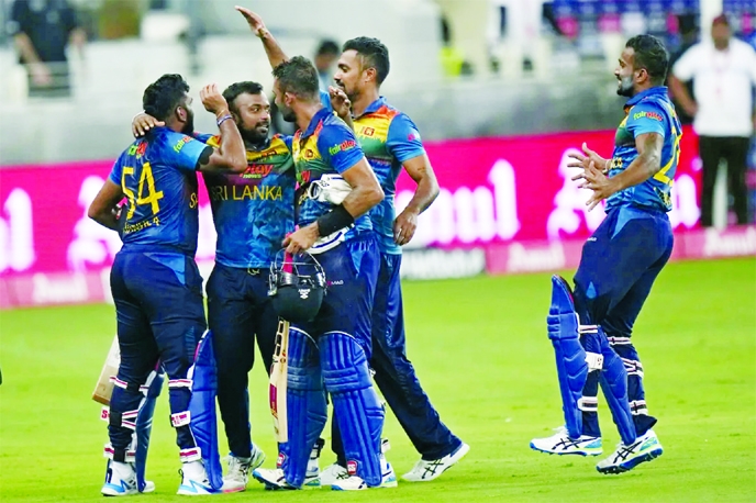 Players of Sri Lanka celebrate after beating India in their ‘Super Four’ match of the Asia Cup at Dubai International Cricket Stadium in the UAE on Tuesday.