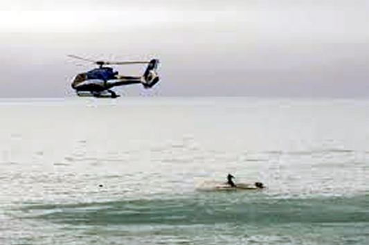 Rescue helicopter is in search of sunken boat passengers in the Pacific after clash with a whale.