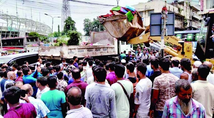 Dhaka South City Corporation conducts an eviction drive against illegal establishments from its declared red-zone streets in city’s Zero Point Gulistan area on Sunday.