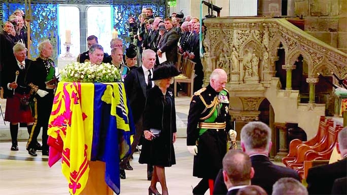 The Royal Family process past the Queen's coffin as they take their seats in Royal Mile to St Giles' Cathedral in Edinburgh, Scotland on Monday.