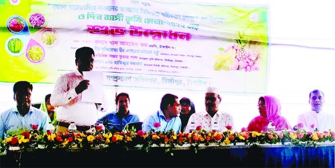 MIRZAPUR (Tangail): Sanjoy Kumar Pal, Upazila Agriculture Officer gives the inaugural speech at the opening ceremony of the three day-long Agriculture Fair in Mirzapur Upazila on Monday.