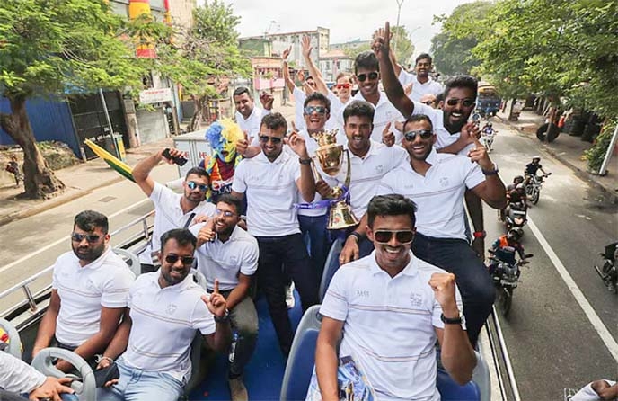 Members of Sri Lanka Cricket team, the winners of the T20 Asia Cup bring out a joyful rally riding on a truck on the road of Colombo, the capital city of Sri Lanka recently.