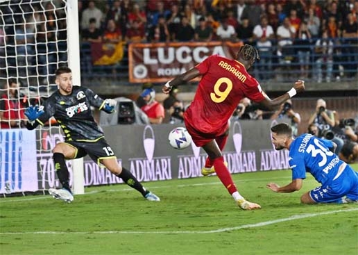 Roma's Tammy Abraham (center) shoots and scores during a Serie A football match against Empoli in Empoli, Italy on Monday.