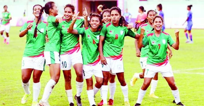 Players of Bangladesh Women's Football team celebrate after defeating India Women's Football team in their last Group-A match of the SAFF Women's Championship at Dasharath Rangasala Stadium in Kathmandu, the capital city of Nepal on Tuesday.