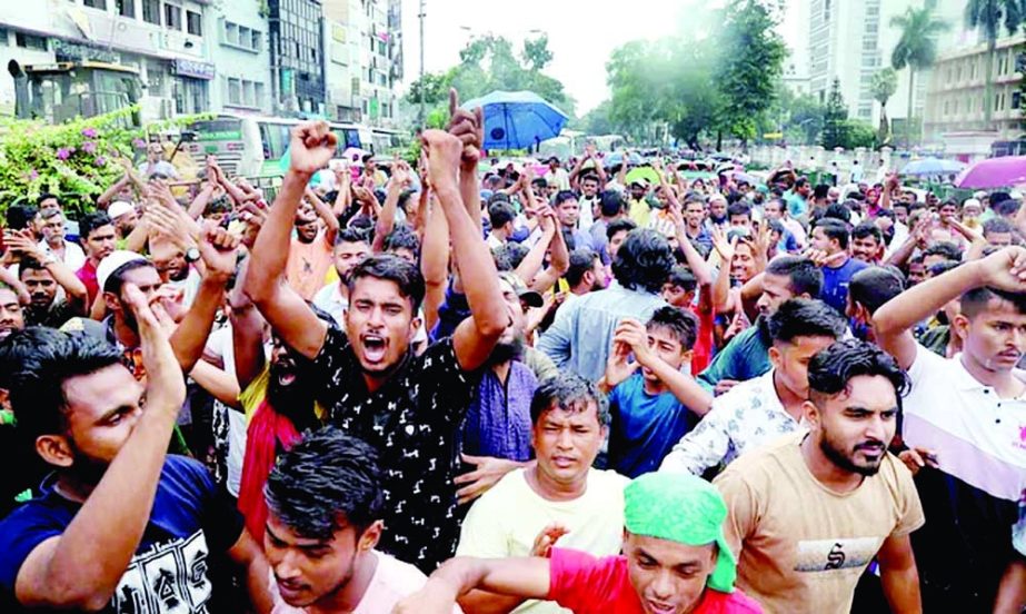 Hawkers demonstrate against a drive by the Dhaka South City Corporation (DSCC) in Gulistan's Zero Point area in the capital on Tuesday. NN photo
