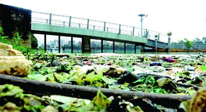 The overall view of Hatirjheel in the capital now in a sordid state as of contaminated water as well as heaps of garbage has changed its lustre. The photo was taken on Friday.