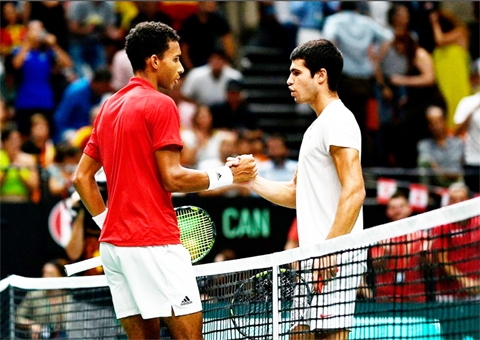 Canada's Felix Auger Aliassime (left) and Spain's Carlos Alcaraz shake hands after their match during the Davis Cup at Pavello Municipal Font de Sant Lluis, Valencia, Spain on Friday.