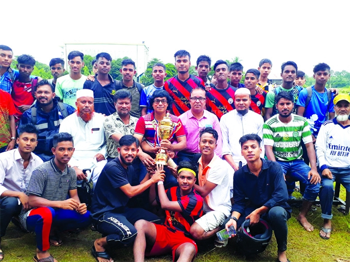 Members of Singair Government High School team, the champions in the Football (Boys') Competition of the Bangladesh School & Madrasa Summer Sports Competition pose with the trophies at Manikganj Hijli Mini Stadium, Manikganj district recently.