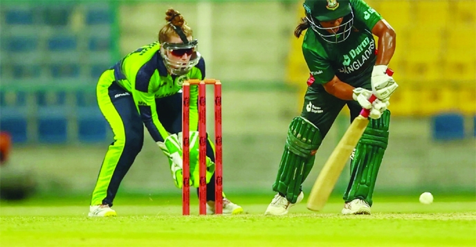 Nigar Sultana (right) of Bangladesh Women's Cricket team plays a shot, while wicketkeeper of Ireland Women's Cricket team watches during their Women's World Cup qualifier match at the UAE on Sunday night.