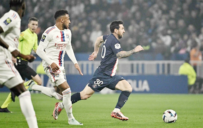 Paris Saint-Germain's forward Lionel Messi (right) runs with the ball during the French L1 football match against Olympique Lyonnais at the Groupama Stadium in Decines-Charpieu, central-eastern France on Sunday.