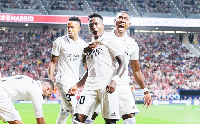 Players of Real Madrid celebrate during a La Liga match against Atletico de Madrid in Madrid, Spain on Sunday.