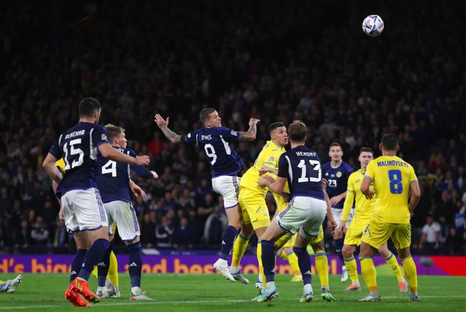 Scotland's Lyndon Dykes (3rd from left) heads in his side's second goal against Ukraine during the UEFA Nations League in Glasgow on Wednesday. Agency photo