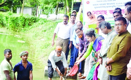 UNO Rounaq Jahan among others releases fish fries at an inauguration programme in Upazila's pond at Gabtali, Bogura on Thursday.