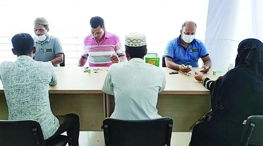 KALAPARA (Patuakhali): Two professional doctors providing free medical treatment to low income people at Muktijuddha Complex Bhaban in Kalapara upazila, Patuakhali on Thursday.