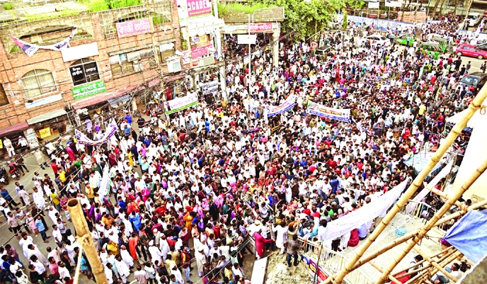 Leaders and activists of Dhaka north BNP stage a rally in Bosila Mohammadpur area in the capital on Friday, protesting the price hike of daily essentails and the killing of Shaon.