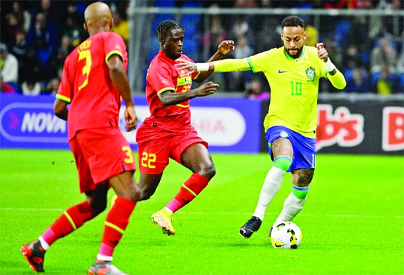 Brazil's forward Neymar (right) fights for the ball with Ghana's forward Kamaldeen Sulemana (center) during the friendly football match between Brazil and Ghana at the Oceane Stadium in Le Havre, northwestern France on Friday.