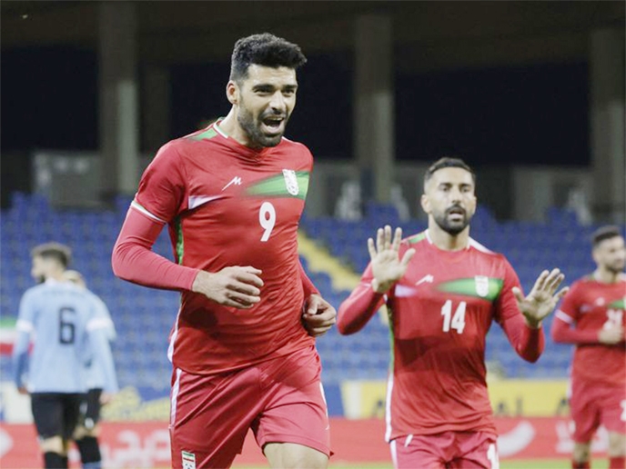 Iran's Mehdi Taremi (left) celebrates scoring against Uruguay at the NV Arena, St Poelten, Austria during their international friendly on Friday.