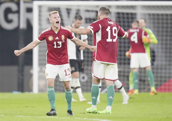 Hungary's Andras Schafer (left) and Hungary's Martin Ádám celebrate their victory in the UEFA Nations League soccer match between Germany and Hungary at the Red Bull Arena in Leipzig, Germany on Friday.