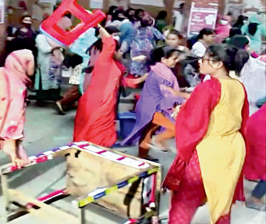 Leaders and activists of Eden Mohila College unit of Bangladesh Chhatra League (BCL) lock into a clash on college premises in the capital on Sunday. NN photo