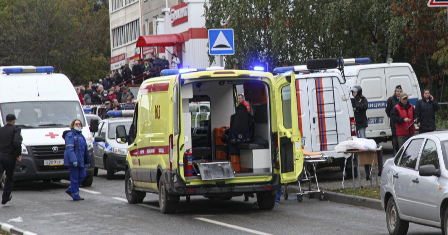 Police and paramedics work at the scene of a shooting at school No. 88 in Izhevsk, Russia, Monday, Sept. 26, 2022.