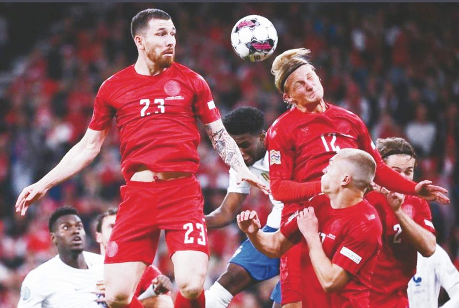 Denmark's midfielder Pierre-Emile Hojbjerg (left) and Denmark's forward Kasper Dolberg both jump to head the ball during the UEFA Nations League football match between Denmark and France in Copenhagen on Sunday. Agency photo