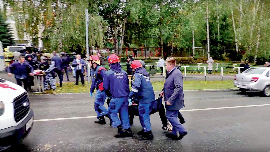 Police and paramedics rescue the body of a school student at the scene of a shooting in the city of Izhevsk in central Russia on Monday. Agency photo