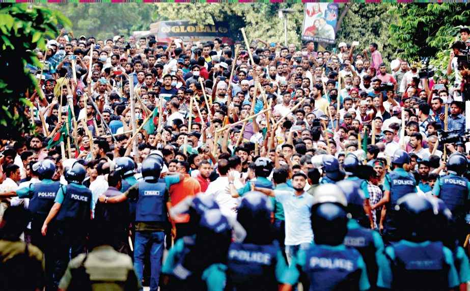 Police put a barricade in front of a BNP procession at Hazaribagh in the capital on Monday afternoon following a clash between the activists of BNP and Awami League. NN photo