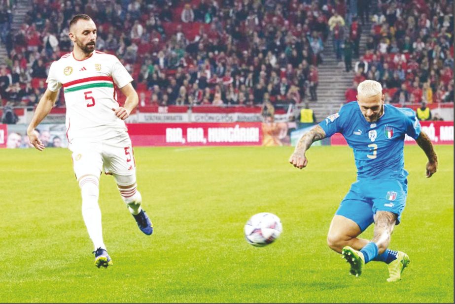 Attila Fiola (left) of Hungary vies with Federico Dimarco of Italy during their League A Group 3 match at the 2022 UEFA Nations League in Budapest, Hungary on Monday. Agency photo